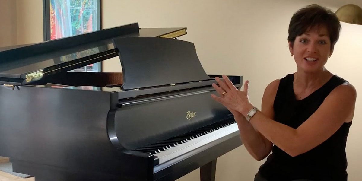 Person Infront Of Boston Piano