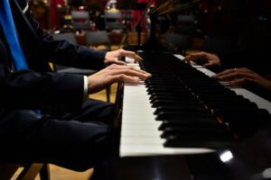 Photo of concert pianist's hands playing a Steinway concert grand.