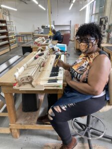 A Steinway tone regulator testing a keyboard.