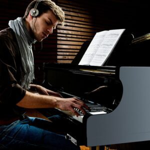Man playing a silent piano
