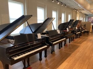 A row of new Steinway grands at M. Steinert & Sons in Boston