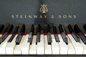 Photo of moving keys on a Steinway Spirio self-playing piano.