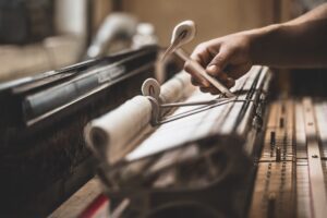 Action being tested at Steinway's Astoria factory