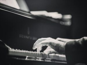 Concert pianist hands on Steinway keyboard
