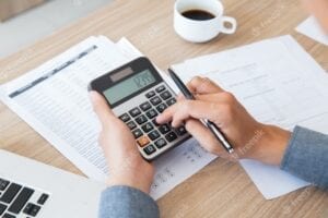 Photo of man calculating a payment