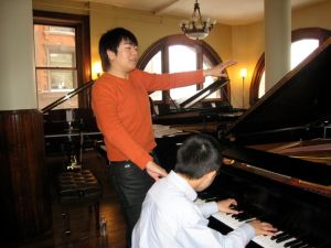 Chinese pianist Lang Lang conducts a Master Class at M. Steinert & Sons.
