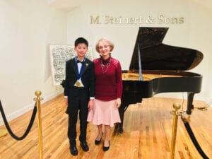 Photo of Boston-area piano instructor with young student.