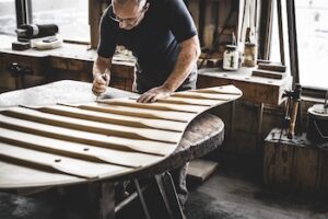 Steinway craftsperson with soundboard