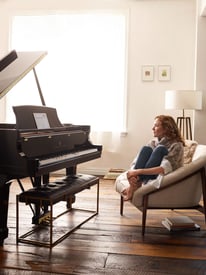 Woman_seated_with_Spirio_with_no_socks_Dock_of_the_Bay_ipad